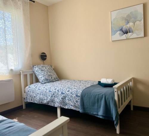 Postel nebo postele na pokoji v ubytování Les clés de jade