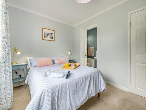 a bedroom with a bed with a tray on it at Hill View in Pateley Bridge
