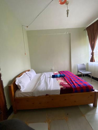 Una cama o camas en una habitación de Florence homestay sipi falls