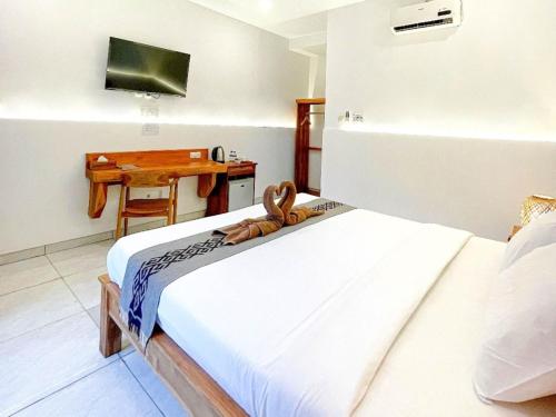Postel nebo postele na pokoji v ubytování Balian Paradise Hotel