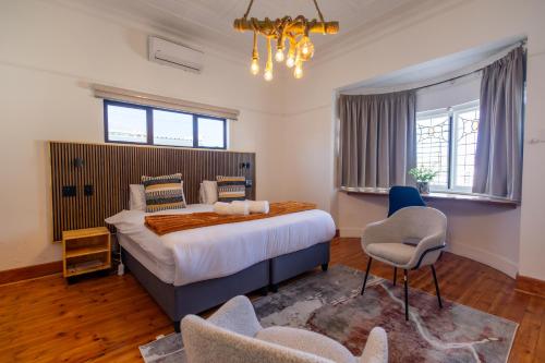 Ένα ή περισσότερα κρεβάτια σε δωμάτιο στο Fusion House B&B and Conference Venue