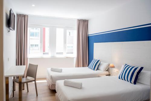 Posteľ alebo postele v izbe v ubytovaní Hotel Náutico Santander