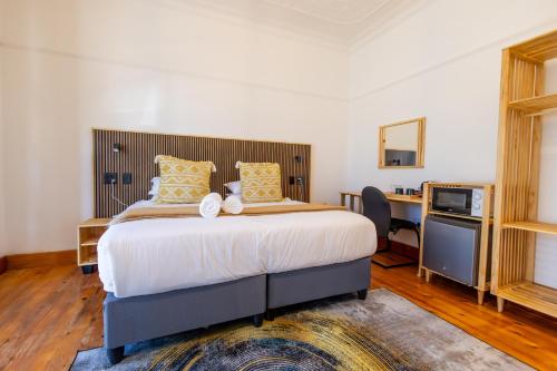 Ένα ή περισσότερα κρεβάτια σε δωμάτιο στο Fusion House B&B and Conference Venue