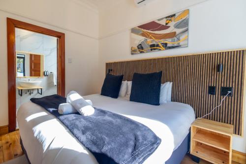 Ένα ή περισσότερα κρεβάτια σε δωμάτιο στο Fusion House B&B and Conference Venue