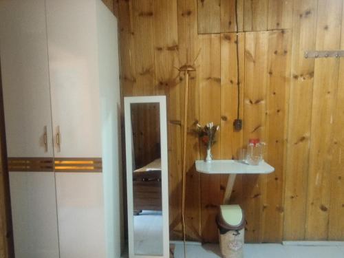a bathroom with a toilet and a sink at Hotel Family Bachi in Adishi