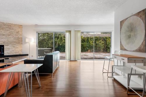 a living room with a table and a dining room at Modern spacious home close to Universal studio & Hollywood for 11 in Los Angeles