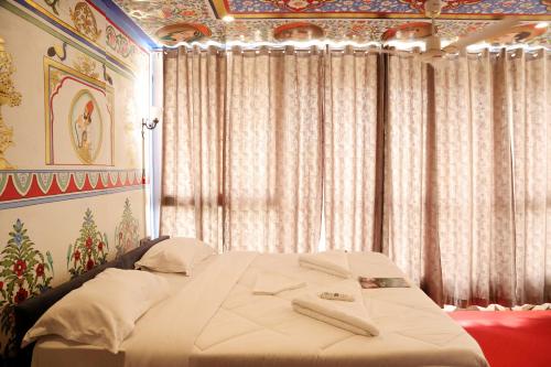 Katil atau katil-katil dalam bilik di Island Tower Boutique Hotel