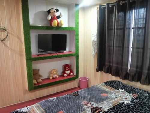Katil atau katil-katil dalam bilik di The Buddhi Sadan Homestay