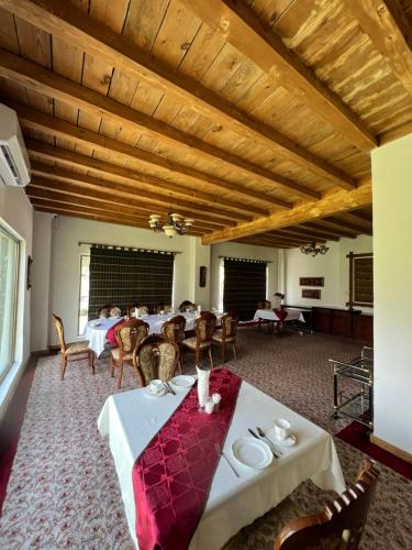 a dining room with a table and chairs at Hotel - Restaurant Siren in Khorog