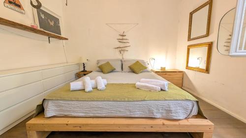 Postel nebo postele na pokoji v ubytování Wood House Bergamo
