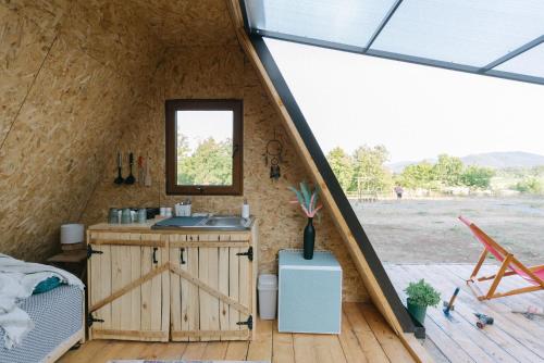 a kitchen in a tiny house with a window at Sve Mir in Boljevac