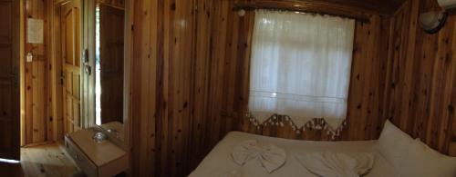 Кровать или кровати в номере Korsan Pension