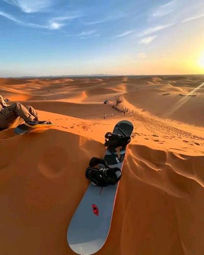 a snowboard in the sand in the desert at Sahara Elegance Camp in Merzouga