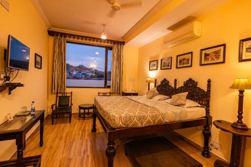 Ένα ή περισσότερα κρεβάτια σε δωμάτιο στο Haveli Inn Pal