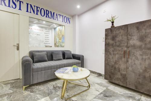 a living room with a couch and a table at Hotel S B Inn Near New Delhi railway Station Paharganj in New Delhi