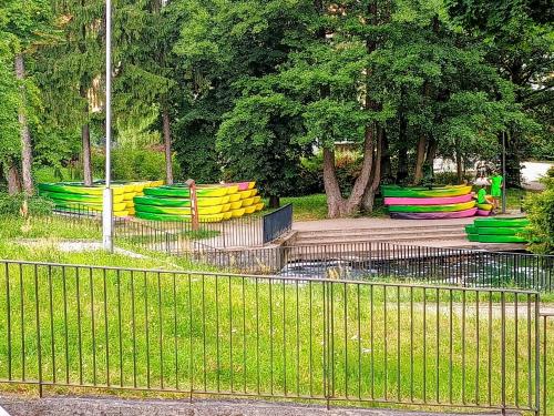 a park with colorful benches in a park at 3-Pokojowy Apartament Villa Park - Top Location in Olsztyn