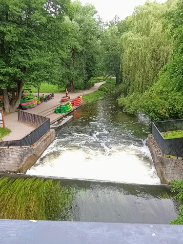 a river with several boats in it at 3-Pokojowy Apartament Villa Park - Top Location in Olsztyn