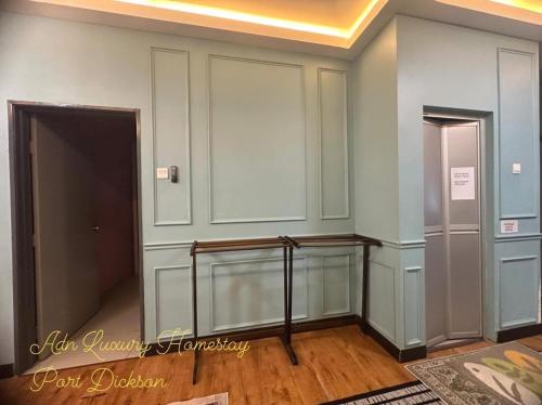 a hallway with two elevators in a room at ADN LUXURY Homestay KARAOKE, POOL,NETFLIX,ASTRO,BBQ in Port Dickson