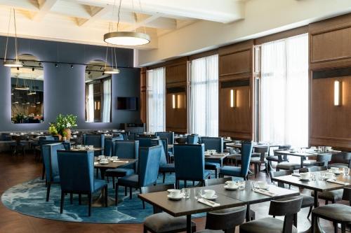 a dining room filled with tables and chairs at The Marmorosch Bucharest, Autograph Collection in Bucharest