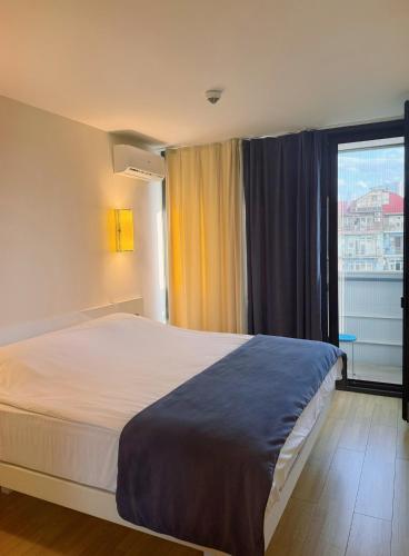 Ένα ή περισσότερα κρεβάτια σε δωμάτιο στο Sea View Apartment