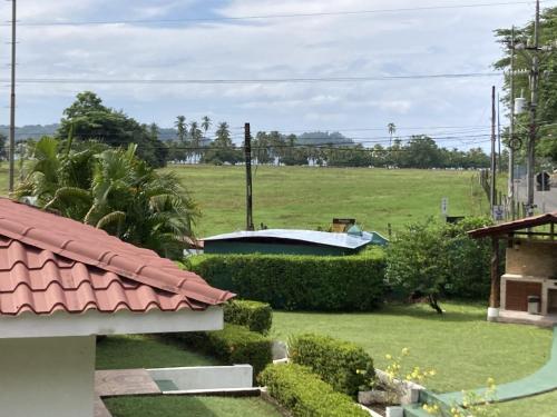 a view of a field from a house at Samara Beach Las Palmeras Condo with Ocean view in Sámara