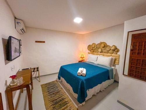 Ένα ή περισσότερα κρεβάτια σε δωμάτιο στο Maruê Guesthouse Porto de Pedras