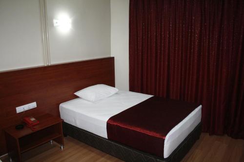 Ένα ή περισσότερα κρεβάτια σε δωμάτιο στο otel flash