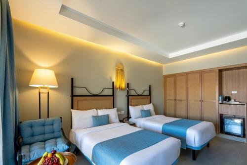 Katil atau katil-katil dalam bilik di Sunny Days Palma De Mirette Resort & Spa