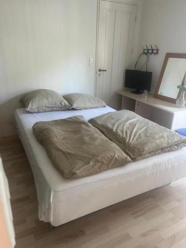 Postel nebo postele na pokoji v ubytování Hvil og sov Filskov