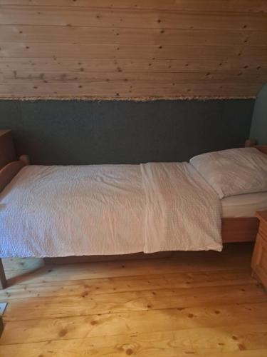 Postel nebo postele na pokoji v ubytování Świerkowy Zakątek u Bacy