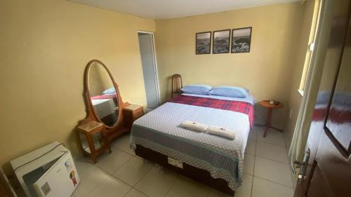 Una cama o camas en una habitación de RioSlz Hostel