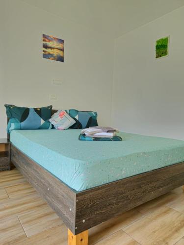 a mattress sitting on top of a bed in a room at Casa Adrian in Corbu