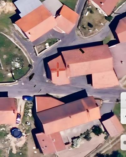an overhead view of a church with a red cross at Appartement de charme Saint-Romain in Saint-Romain