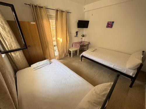 Ένα ή περισσότερα κρεβάτια σε δωμάτιο στο Seaside Apartments & Rooms Kampouri