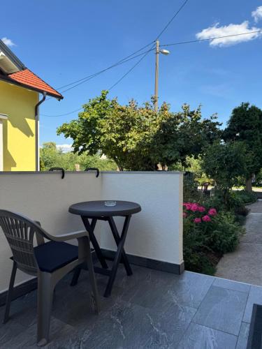 a table and a chair on a patio at Miki in Sarajevo
