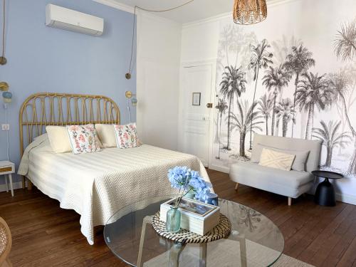 Ένα ή περισσότερα κρεβάτια σε δωμάτιο στο Chambres d'hotes - Le Magnolia