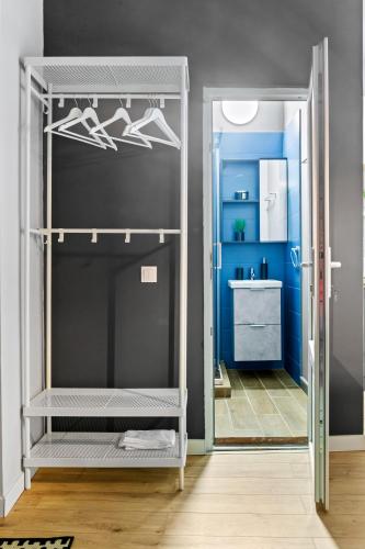 a room with a closet with a door open at Old Town Smârdan Studios - Central Lively Area in Bucharest