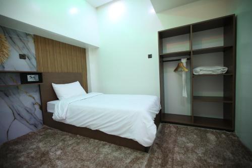 Ένα ή περισσότερα κρεβάτια σε δωμάτιο στο tourist apartments