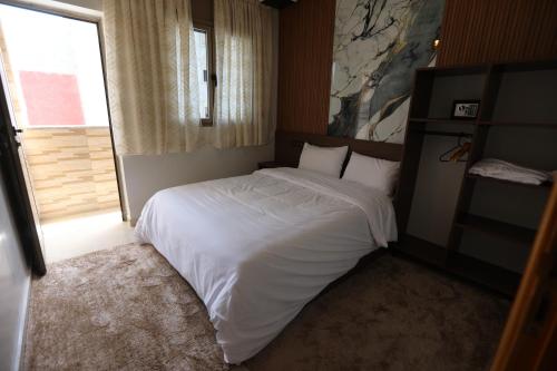 Ένα ή περισσότερα κρεβάτια σε δωμάτιο στο tourist apartments