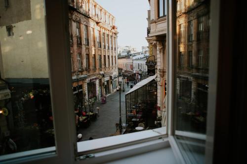 a view of a street from a window at Old Town Cozy Suites Smârdan - Pumo Properties in Bucharest