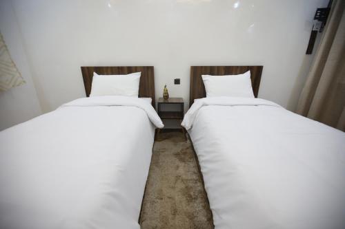 Ένα ή περισσότερα κρεβάτια σε δωμάτιο στο tourist apartments