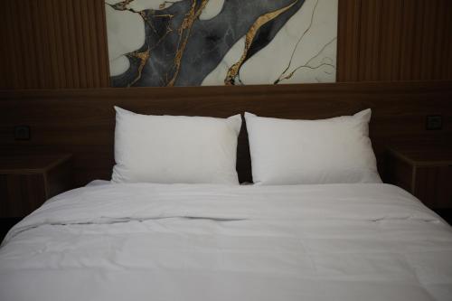 Ένα ή περισσότερα κρεβάτια σε δωμάτιο στο tourist apartments