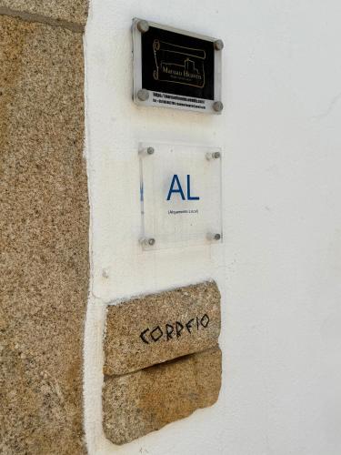 a sign on the side of a building at Maruan Heaven in Marvão