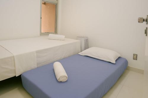 Unique Residence, próximo ao Parque e Shopping Flamboyantにあるベッド