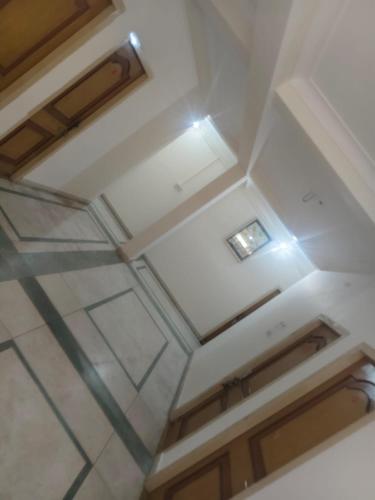 an overhead view of a white coffered ceiling at Oyo The Jhunjhunu Palace Hotel in Jhunjhunūn
