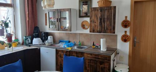 a kitchen with a sink and a counter top at Gasthaus Schmidt's in Neuhaldensleben