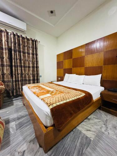 Кровать или кровати в номере Comfort Rezidor Guest House