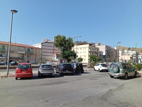 a group of cars parked in a parking lot at Monolocale Libertà in Reggio Calabria