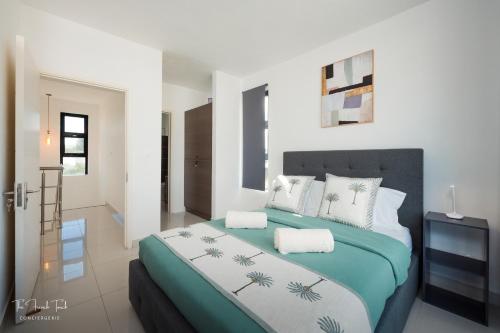 Ένα ή περισσότερα κρεβάτια σε δωμάτιο στο Villa Bel Lavi - Plage à 5 min & Services sur-mesure