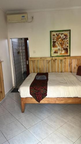 Postel nebo postele na pokoji v ubytování Sari Buana Bed & Breakfast